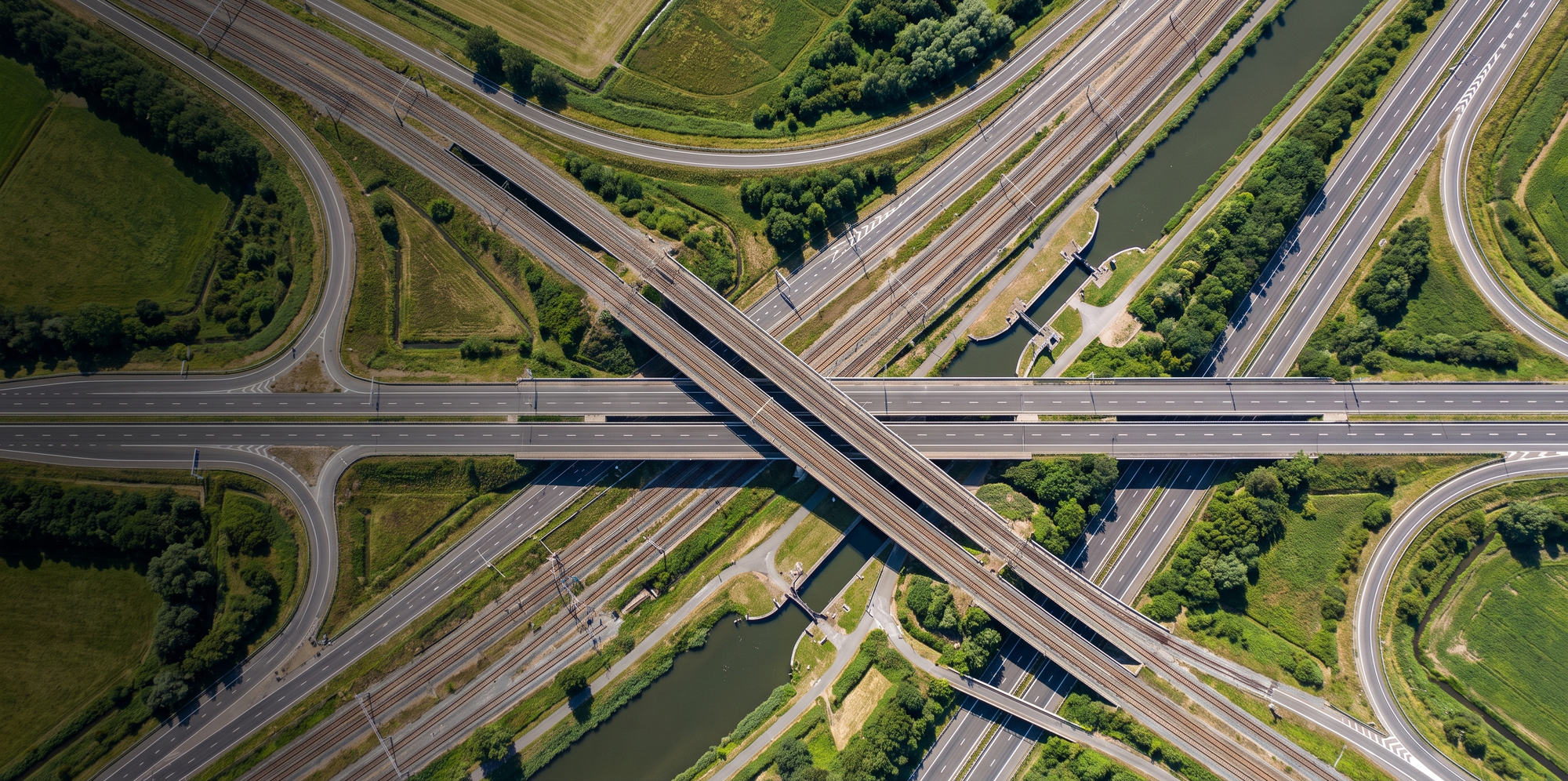 Overhead view of an interchange where road, rail and waterway cross